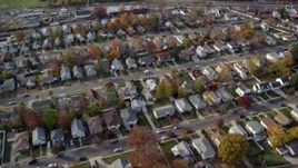 5.5K aerial stock footage of flying over a quiet suburban neighborhood in Autumn, Hempstead, New York Aerial Stock Footage | AX120_029E