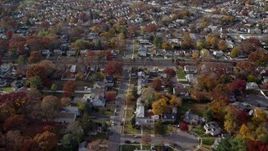 5.5K aerial stock footage fly over golf course and suburbs in Autumn, West Hempstead, New York Aerial Stock Footage | AX120_031E