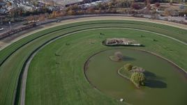 5.5K aerial stock footage of flying over a horse-racing track in Autumn, Elmont, New York Aerial Stock Footage | AX120_040