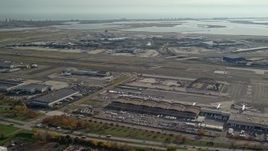 5.5K aerial stock footage of flying toward John F. Kennedy International Airport in Autumn, in New York Aerial Stock Footage | AX120_050E