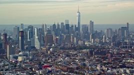 5.5K aerial stock footage of Lower Manhattan's tall skyline seen from Brooklyn in Autumn, New York City Aerial Stock Footage | AX120_082