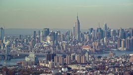 5.5K aerial stock footage of the Midtown Manhattan skyline seen from Brooklyn in Autumn, New York City Aerial Stock Footage | AX120_083