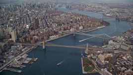 5.5K aerial stock footage of a view of the Brooklyn and Manhattan Bridges in Autumn, New York City Aerial Stock Footage | AX120_094