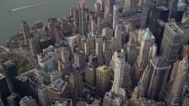 5.5K aerial stock footage of looking down on Lower Manhattan skyscrapers in Autumn, New York City Aerial Stock Footage | AX120_097