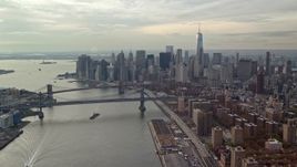 5.5K aerial stock footage approach Brooklyn and Manhattan Bridges and Lower Manhattan from East River, New York City Aerial Stock Footage | AX120_140E