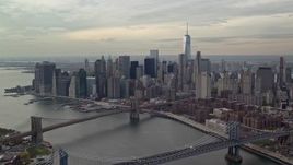 5.5K aerial stock footage approach Manhattan Bridge, Brooklyn Bridges and Downtown, Lower Manhattan, New York City Aerial Stock Footage | AX120_143E