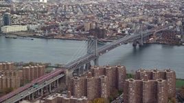 5.5K aerial stock footage approach the Williamsburg Bridge in Autumn, New York City Aerial Stock Footage | AX120_151E