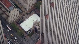 5.5K aerial stock footage orbit ice rink at Rockefeller Center, Midtown, New York City Aerial Stock Footage | AX120_186E