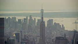 5.5K aerial stock footage of the top of the Empire State Building and Lower Manhattan, New York City Aerial Stock Footage | AX120_225E