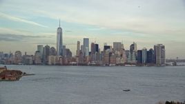 5.5K aerial stock footage of a wide view of Lower Manhattan seen from Ellis Island in Autumn, New York City Aerial Stock Footage | AX120_257