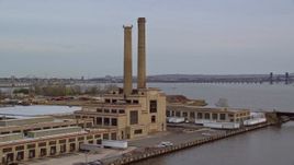 5.5K aerial stock footage approach waterfront factory with smoke stacks at twilight, Kearny, New Jersey Aerial Stock Footage | AX121_001E