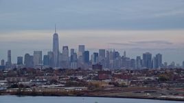 5.5K aerial stock footage of the Lower Manhattan skyline at twilight in Autumn, New York City Aerial Stock Footage | AX121_003E