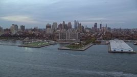 5.5K aerial stock footage approach piers on the shore of Brooklyn at twilight in New York City Aerial Stock Footage | AX121_020