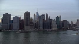 5.5K aerial stock footage of Lower Manhattan riverfront skyline at twilight, New York City Aerial Stock Footage | AX121_021E