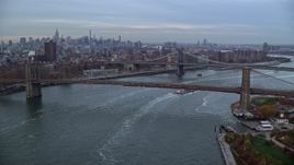 5.5K aerial stock footage approach the Brooklyn and Manhattan Bridges at twilight in New York City Aerial Stock Footage | AX121_023
