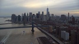 5.5K aerial stock footage of the Manhattan Bridge and Lower Manhattan skyline at twilight in New York City Aerial Stock Footage | AX121_027E