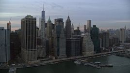 5.5K aerial stock footage of riverfront Lower Manhattan skyscrapers at twilight in New York City Aerial Stock Footage | AX121_036E