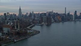5.5K aerial stock footage of an East Village power plant and Midtown skyscrapers at twilight in New York City Aerial Stock Footage | AX121_046E