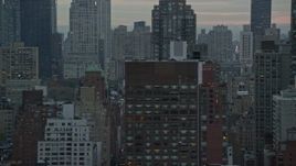 5.5K aerial stock footage flyby streets and Midtown Manhattan skyscrapers at twilight in New York City Aerial Stock Footage | AX121_056E