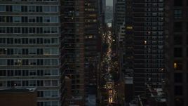 5.5K aerial stock footage of Midtown skyscrapers and busy streets at twilight in New York City Aerial Stock Footage | AX121_064E