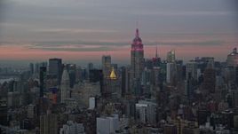 5.5K aerial stock footage of Empire State Building at twilight in Midtown, New York City Aerial Stock Footage | AX121_077