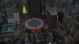 5.5K aerial stock footage approach and orbit Madison Square Garden at twilight in New York City Aerial Stock Footage | AX121_084E