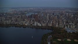 5.5K aerial stock footage orbit Upper East Side skyscrapers near Central Park at twilight in New York City Aerial Stock Footage | AX121_096