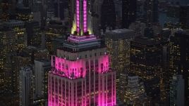 5.5K aerial stock footage orbiting around the top of Empire State Building at twilight in Midtown Manhattan, New York City Aerial Stock Footage | AX121_109