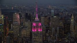5.5K aerial stock footage orbit top half of Empire State Building at twilight in Midtown, New York City Aerial Stock Footage | AX121_110