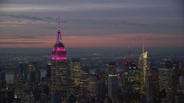 5.5K aerial stock footage of the Empire State Building at twilight in Midtown, New York CIty Aerial Stock Footage | AX121_111E
