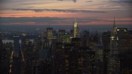 5.5K aerial stock footage orbit Midtown high-rises and reveal Chrysler Building at twilight, New York City Aerial Stock Footage | AX121_115E