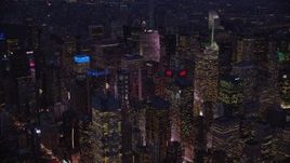 5.5K aerial stock footage orbit Midtown skyscrapers at night in New York City Aerial Stock Footage | AX121_130E