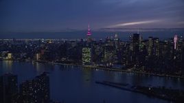 5.5K aerial stock footage of UN Building and Midtown seen from Queens at Night in New York City Aerial Stock Footage | AX121_142E