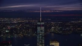 5.5K aerial stock footage of slowly orbiting One World Trade Center in downtown at Night in New York City Aerial Stock Footage | AX121_162E