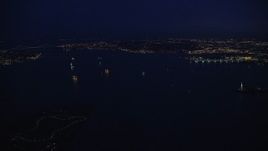 5.5K aerial stock footage of ships on New York Harbor at Night Aerial Stock Footage | AX121_165E