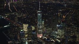 5.5K aerial stock footage of a slow approach to the top of Freedom Tower at Night in Lower Manhattan, New York City Aerial Stock Footage | AX121_174