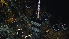 5.5K aerial stock footage of flying away from One World Trade Center at Night in Lower Manhattan, New York City Aerial Stock Footage | AX121_176