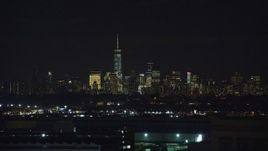 5.5K aerial stock footage of Lower Manhattan skyline in NYC seen from Kearny, New Jersey at Night Aerial Stock Footage | AX121_205E