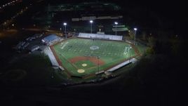 5.5K aerial stock footage of approaching and orbiting a football and baseball stadium at Night in Jersey City, New Jersey Aerial Stock Footage | AX122_007E