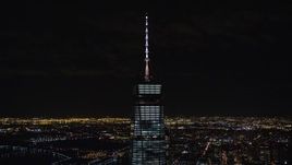 5.5K aerial stock footage orbit spire of One World Trade Center at Night in Lower Manhattan, NYC Aerial Stock Footage | AX122_038