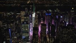 5.5K aerial stock footage orbit Bank of America Tower and Midtown skyscrapers at Night, New York City Aerial Stock Footage | AX122_112E