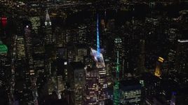 5.5K aerial stock footage orbit the top of Bank of America Tower at Night in Midtown, New York City Aerial Stock Footage | AX122_118E