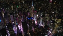 5.5K aerial stock footage orbit skyscrapers around Times Square at Night in Midtown Manhattan, New York City Aerial Stock Footage | AX122_125E
