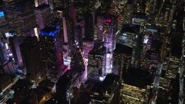 5.5K aerial stock footage of Midtown Manhattan skyscrapers by Times Square at Night in NYC Aerial Stock Footage | AX122_127