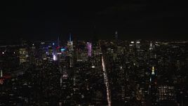5.5K aerial stock footage approach unlit Empire State Building at Night in Midtown, New York City Aerial Stock Footage | AX122_149E