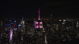 5.5K aerial stock footage approach the Empire State Building at Night in Midtown Manhattan, New York City Aerial Stock Footage | AX122_151E