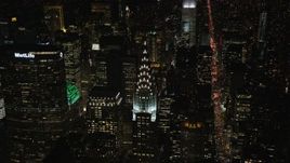 5.5K aerial stock footage of Chrysler Building and Lexington Avenue at Night in Midtown, NYC Aerial Stock Footage | AX122_156E