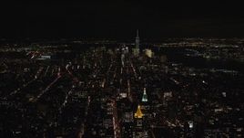 5.5K aerial stock footage approach Lower Manhattan from Midtown at Night in New York City Aerial Stock Footage | AX122_164E