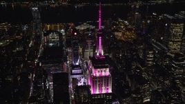 5.5K aerial stock footage of orbiting the Empire State Building at Nighttime in Midtown, NYC Aerial Stock Footage | AX122_166