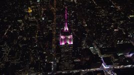 5.5K aerial stock footage orbit the historic Empire State Building and Midtown streets at Night in NYC Aerial Stock Footage | AX122_172